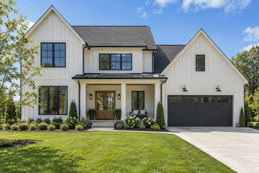 A still listing photo of a modern farmhouse